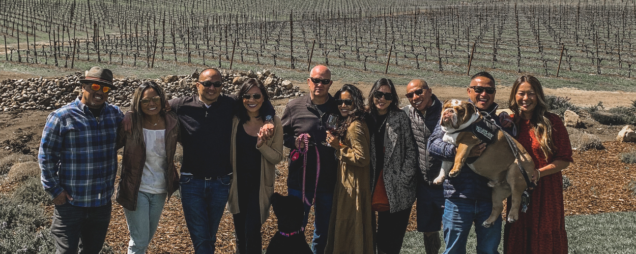 A GROUP WITH DOGS ON A WINE TOUR IN PASO ROBLES