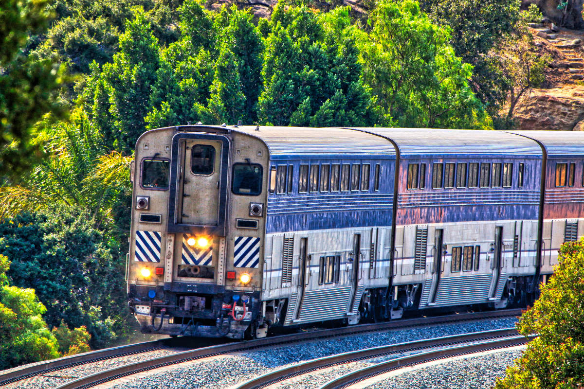 A train in front of trees