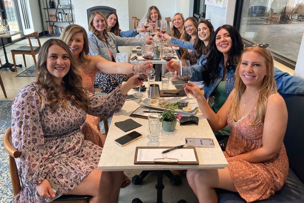 group of girls cheersing to a dinner in paso robles