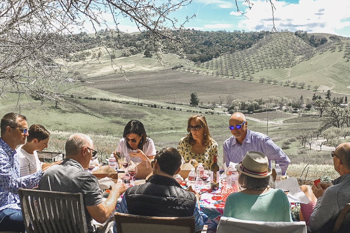 group of people enjoying lunch at a paso robles winery