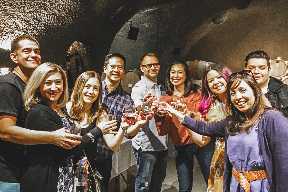 group of people wine tasting in a cave in paso robles