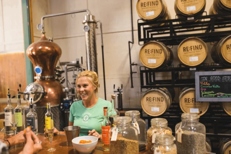 person serving spirits at a distillery in paso robles
