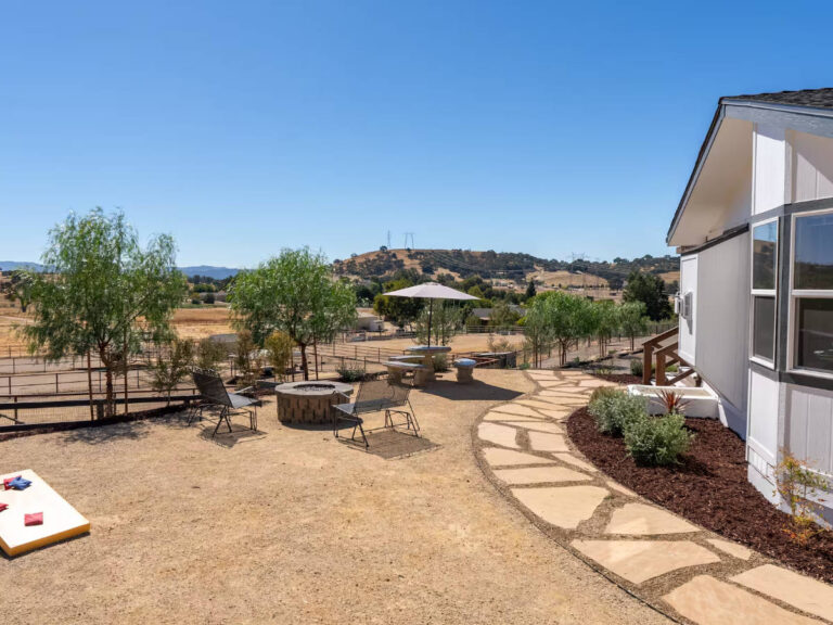 airbnb with a fire pit and corn hole